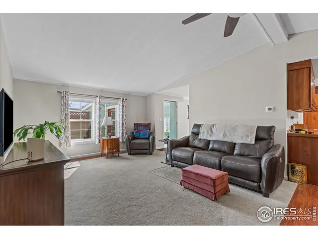 a bed room with a bed and a large window