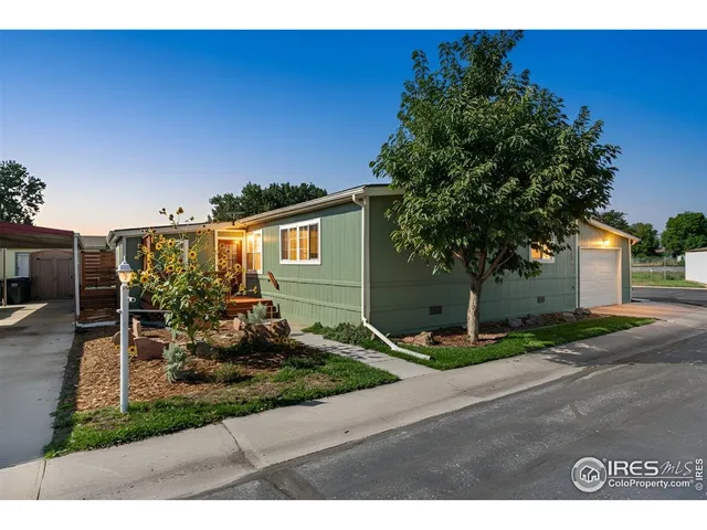 a view of a balcony with wooden benches