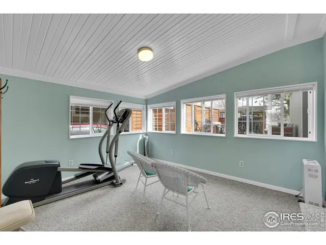 a kitchen with stainless steel appliances granite countertop a refrigerator a sink dishwasher a stove with wooden cabinets and floors