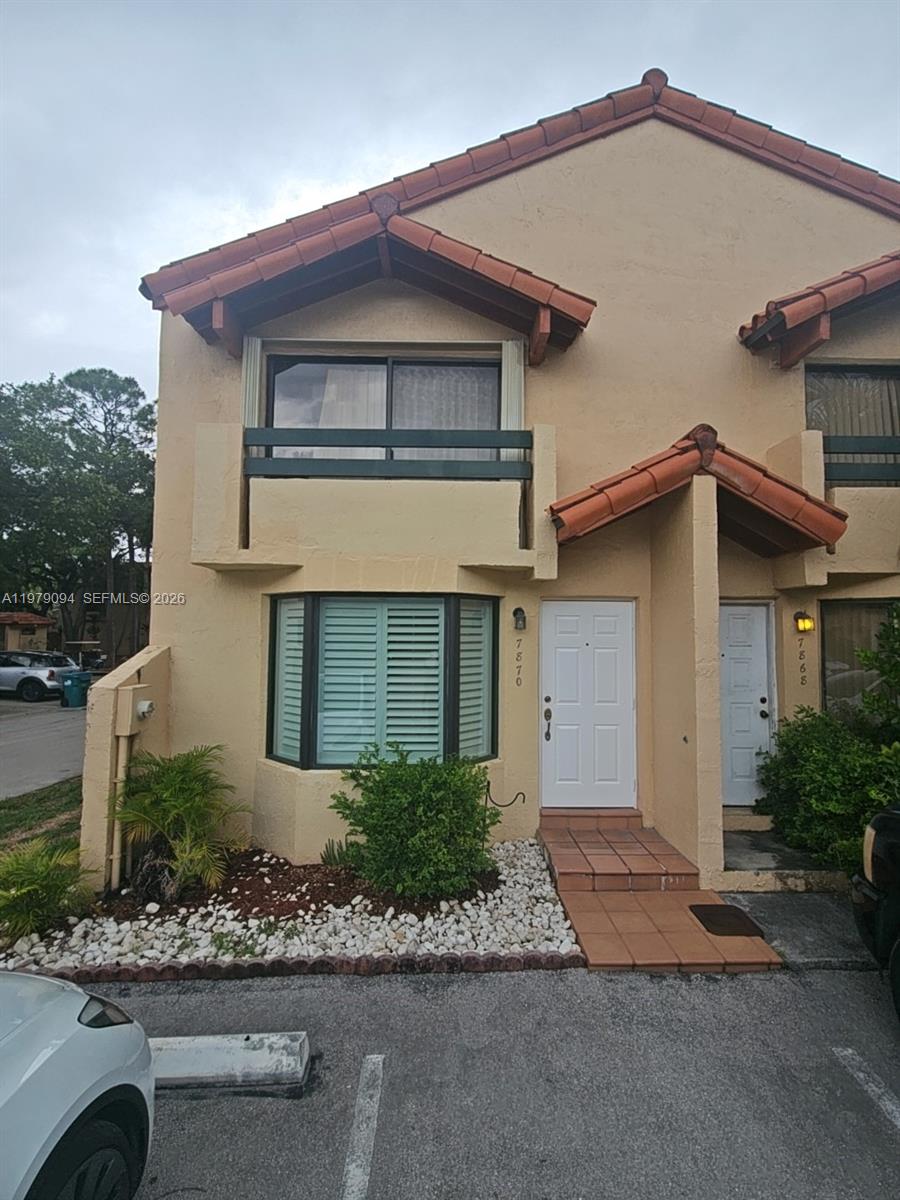 7870 Southwest 102nd Lane Miami, FL 33156 - Photo 1 of 41 a front view of a house with a yard and garage