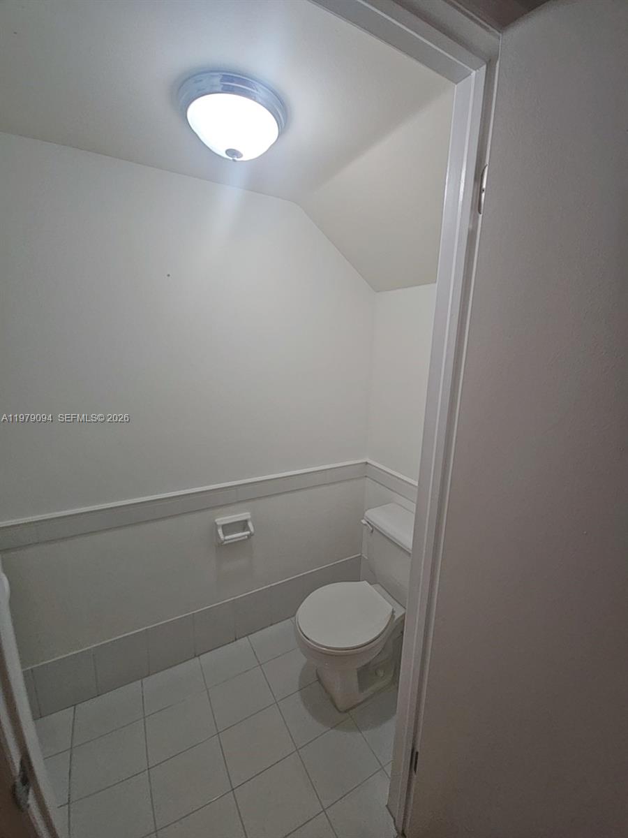 7870 Southwest 102nd Lane Miami, FL 33156 - Photo 16 of 41 a bathroom with a toilet and a shower
