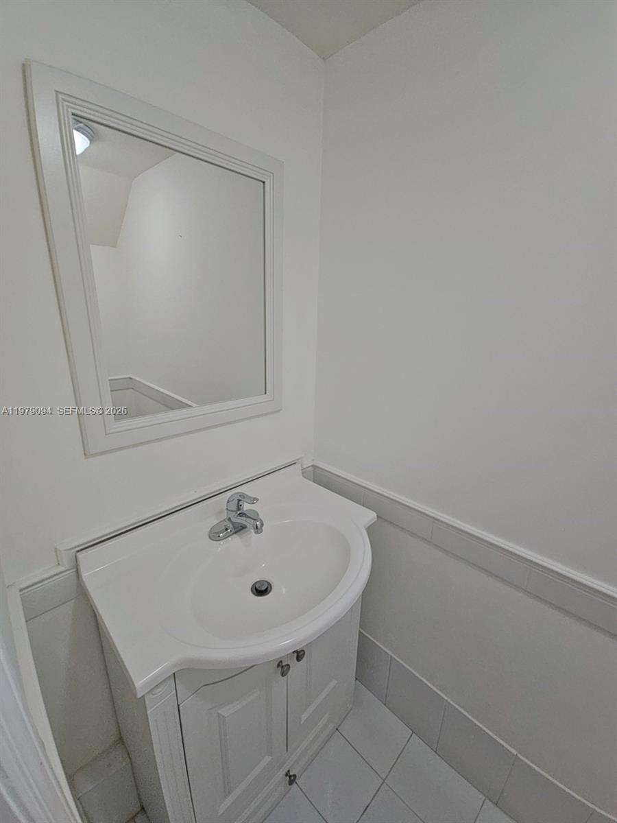 7870 Southwest 102nd Lane Miami, FL 33156 - Photo 17 of 41 a bathroom with a sink and vanity