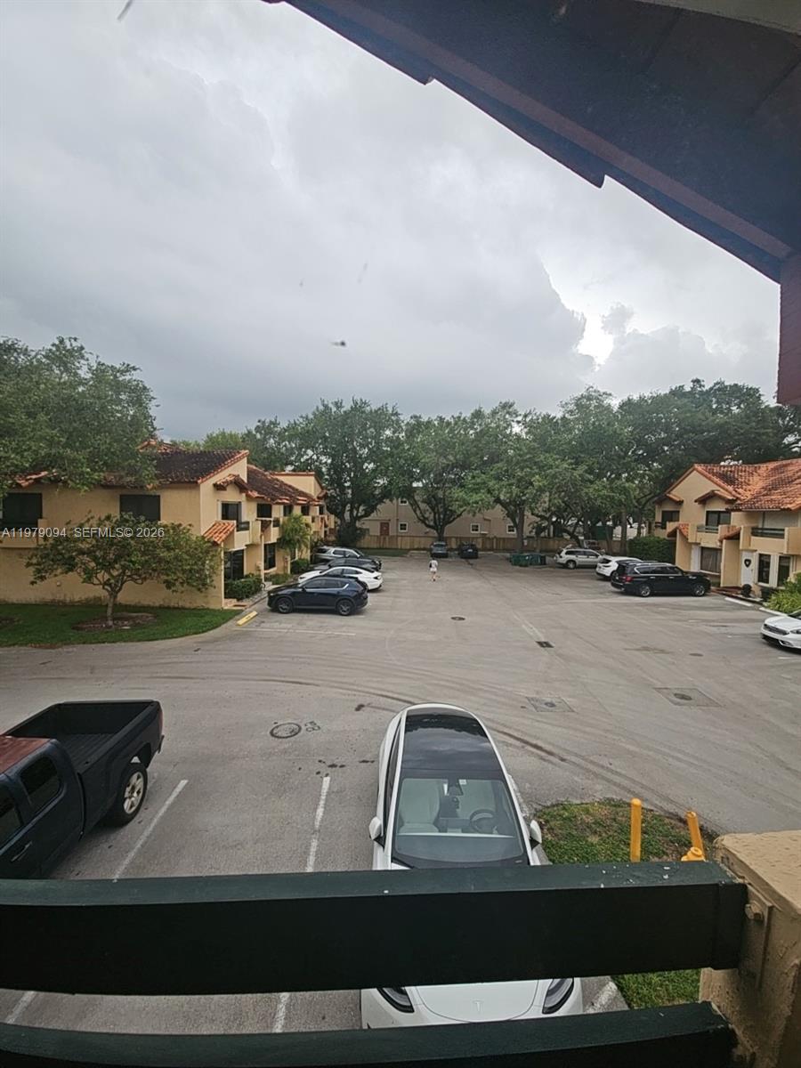 7870 Southwest 102nd Lane Miami, FL 33156 - Photo 21 of 41 a view of car parked on the side of a lake