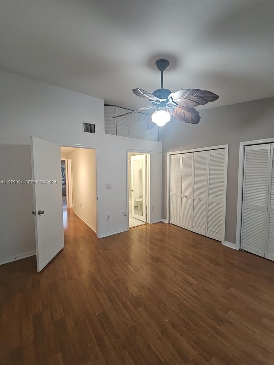 7870 Southwest 102nd Lane Miami, FL 33156 - Photo 27 of 41 a view of an empty room with wooden floor