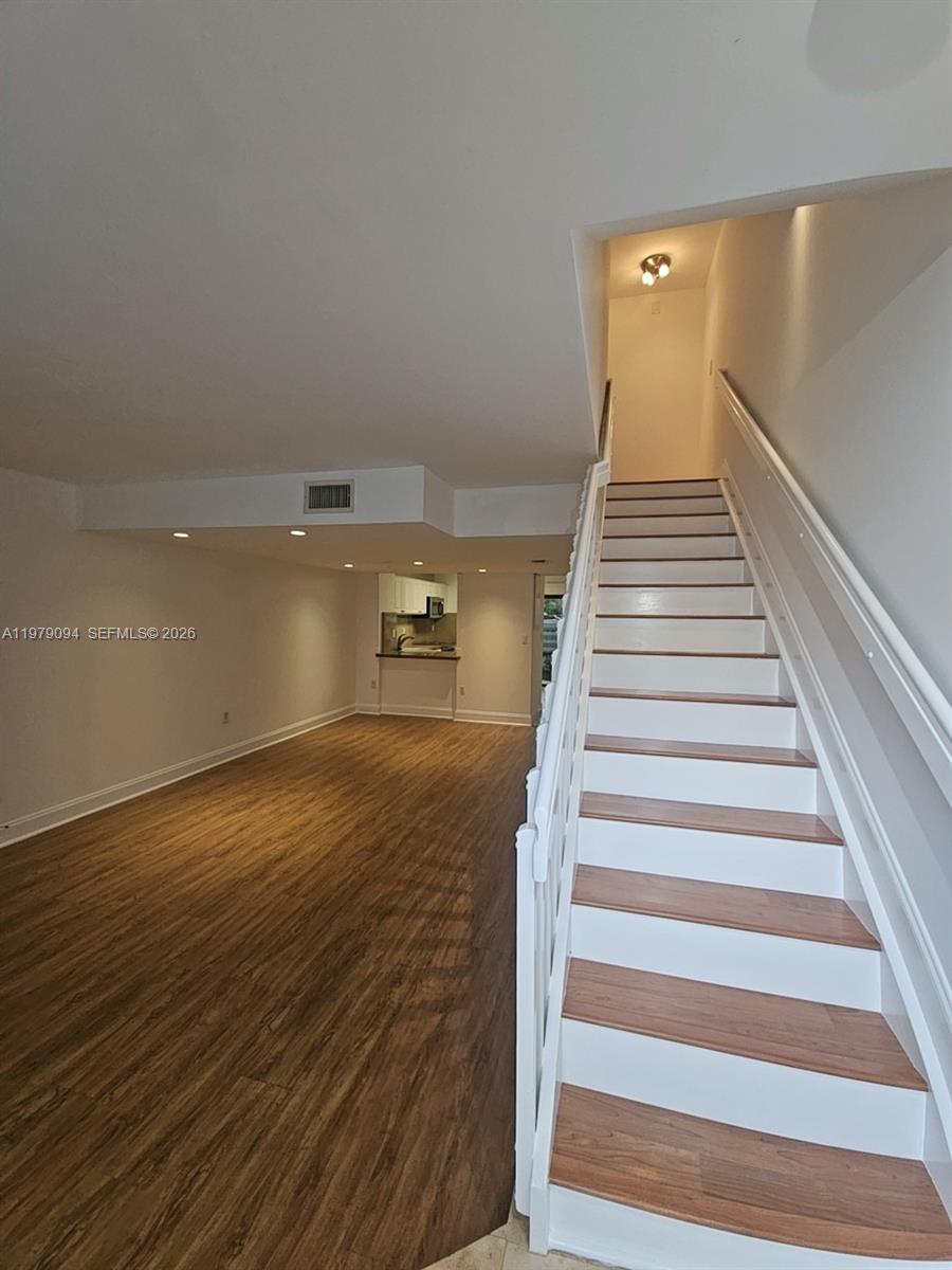 7870 Southwest 102nd Lane Miami, FL 33156 - Photo 3 of 41 a view of entryway and hall with wooden floor
