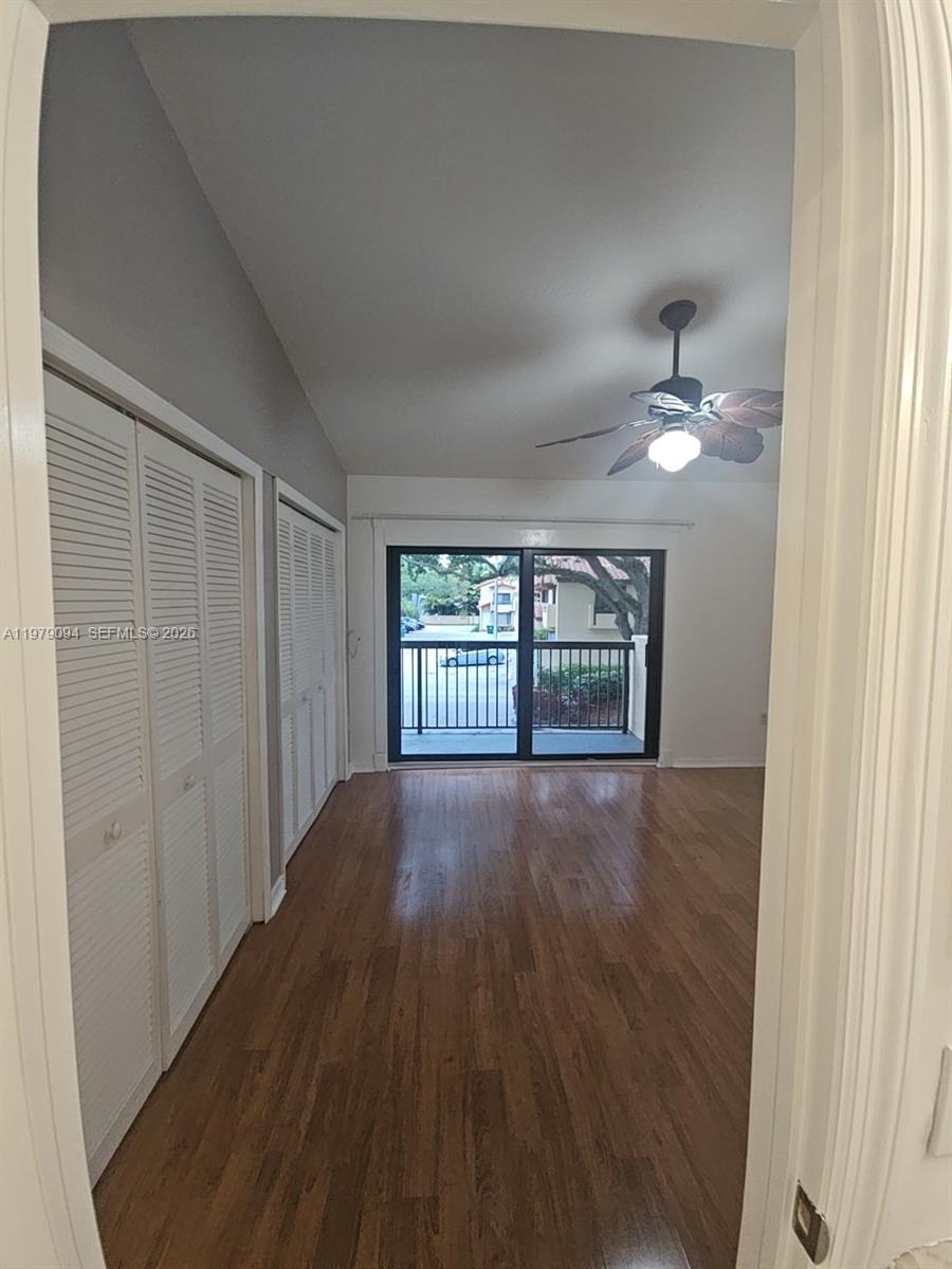 7870 Southwest 102nd Lane Miami, FL 33156 - Photo 38 of 41 a view of an empty room with wooden floor and a window