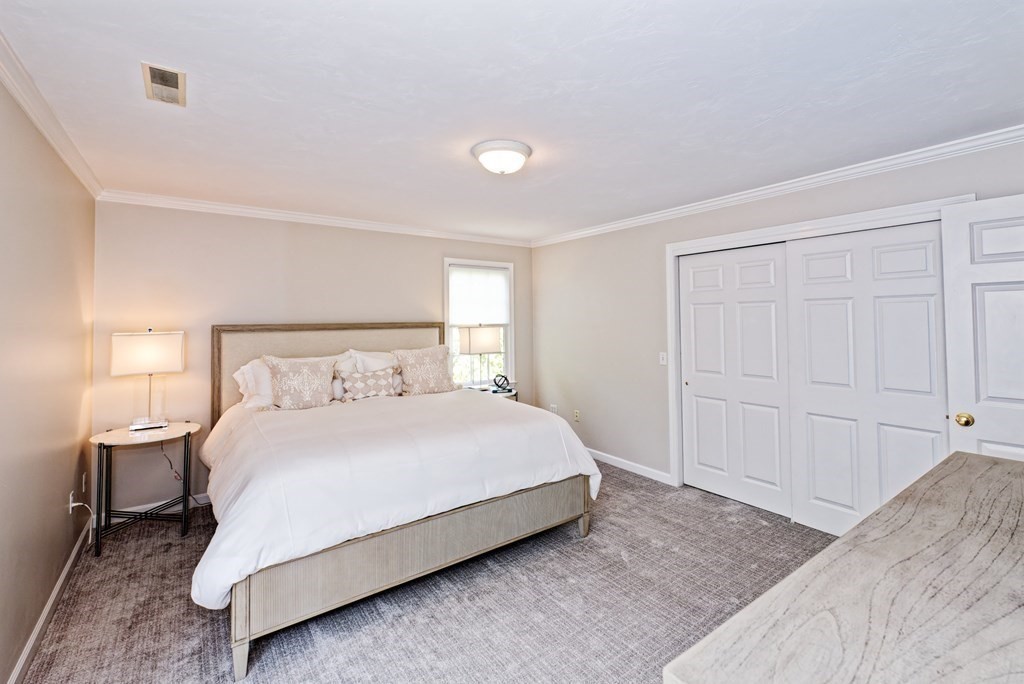 16 Bridle Path Shrewsbury, MA 01545 - Photo 14 of 42 a bedroom with a bed and a lamp