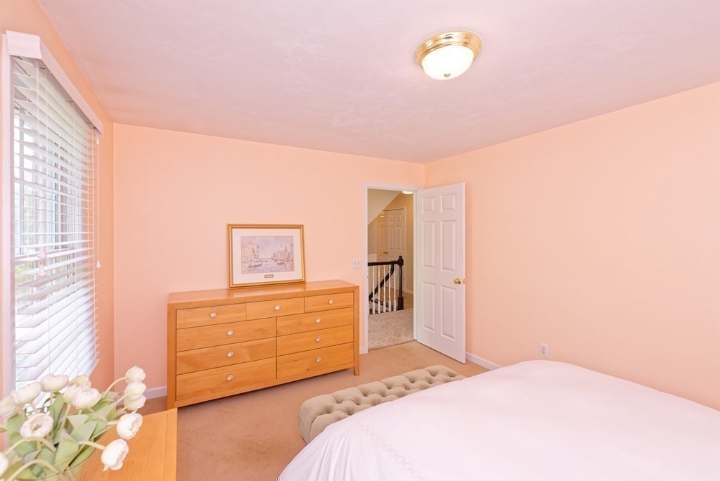 16 Bridle Path Shrewsbury, MA 01545 - Photo 17 of 42 a bedroom with a bed and cabinets