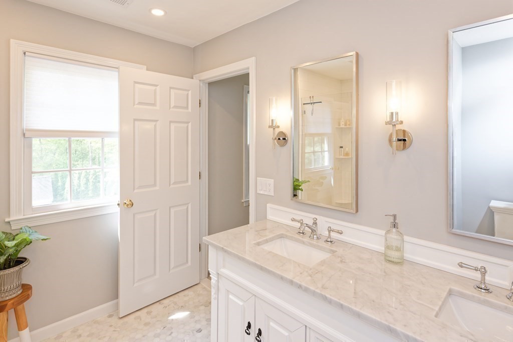 16 Bridle Path Shrewsbury, MA 01545 - Photo 18 of 42 a bathroom with a granite countertop sink and a mirror