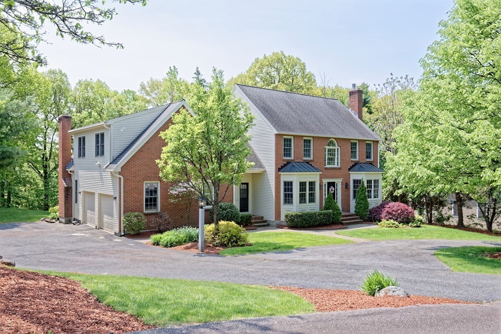 16 Bridle Path Shrewsbury, MA 01545 - Photo 2 of 42 a front view of house with yard and green space
