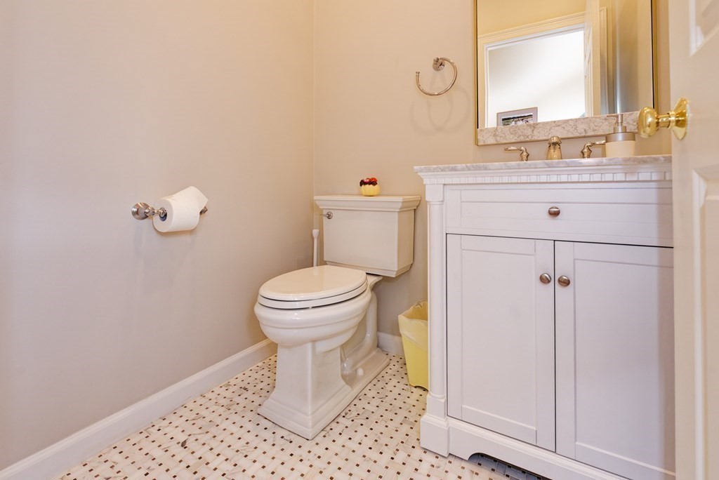 16 Bridle Path Shrewsbury, MA 01545 - Photo 21 of 42 a bathroom with a sink a toilet and a mirror