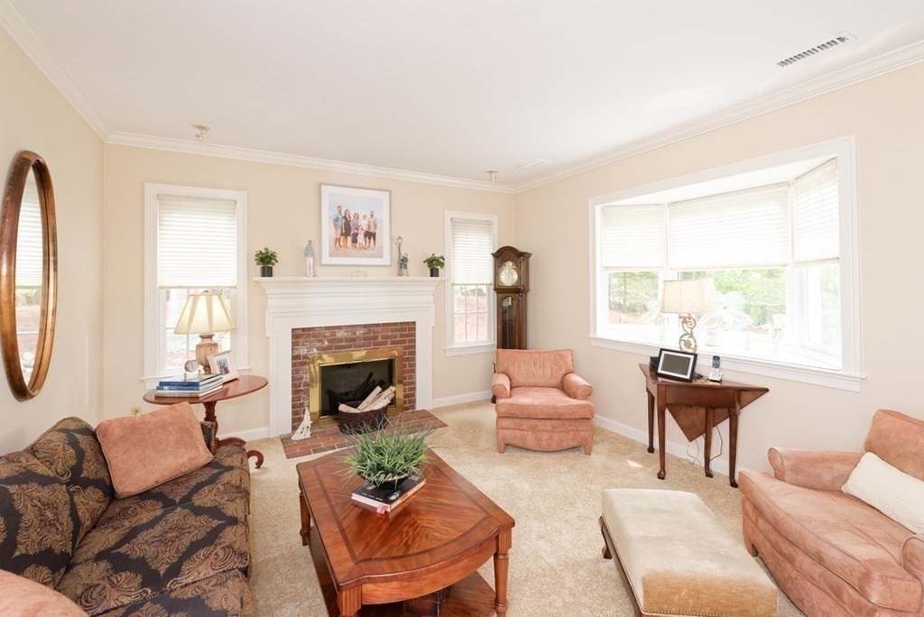 16 Bridle Path Shrewsbury, MA 01545 - Photo 25 of 42 a living room with furniture fireplace and a large window