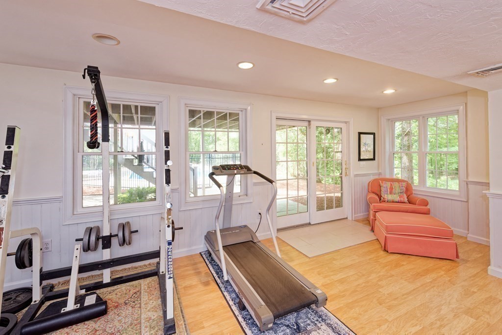 16 Bridle Path Shrewsbury, MA 01545 - Photo 30 of 42 a living room with furniture stove and a table