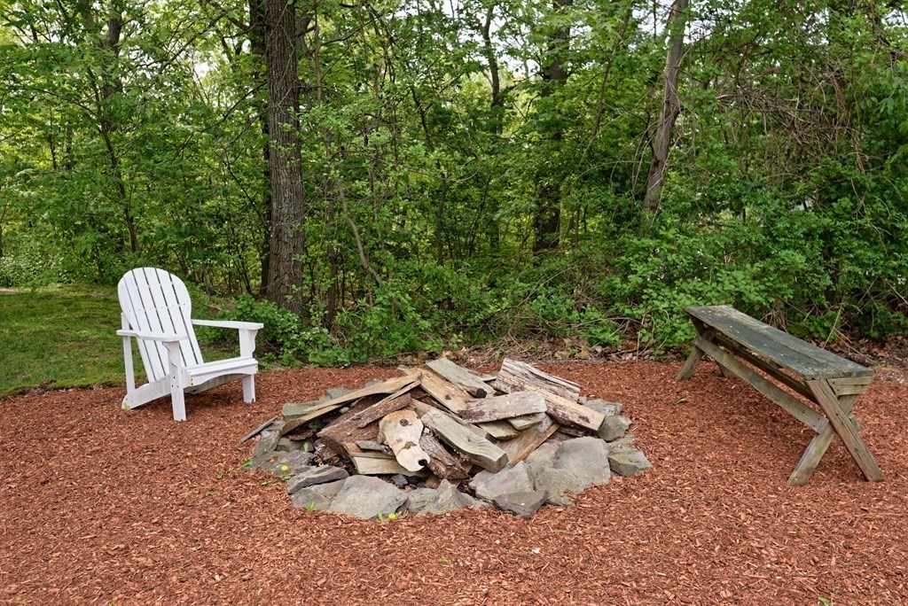 16 Bridle Path Shrewsbury, MA 01545 - Photo 37 of 42 an aerial view of a wooden chairs and backyard in the back