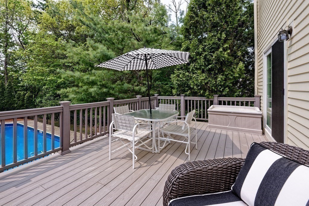 16 Bridle Path Shrewsbury, MA 01545 - Photo 39 of 42 a view of balcony with wooden floor and outdoor seating