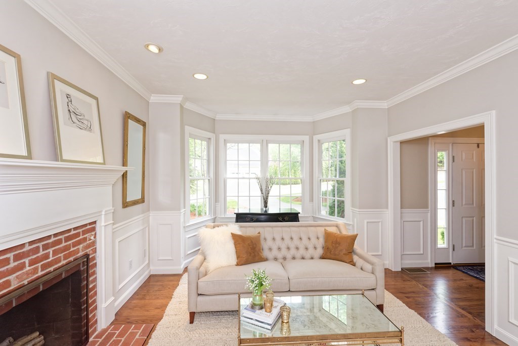16 Bridle Path Shrewsbury, MA 01545 - Photo 8 of 42 a living room with furniture and a fireplace