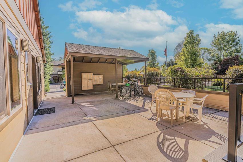 556 G Street Jacksonville, OR 97530 - Photo 9 of 12 a view of a patio with table and chairs with wooden floor and fence