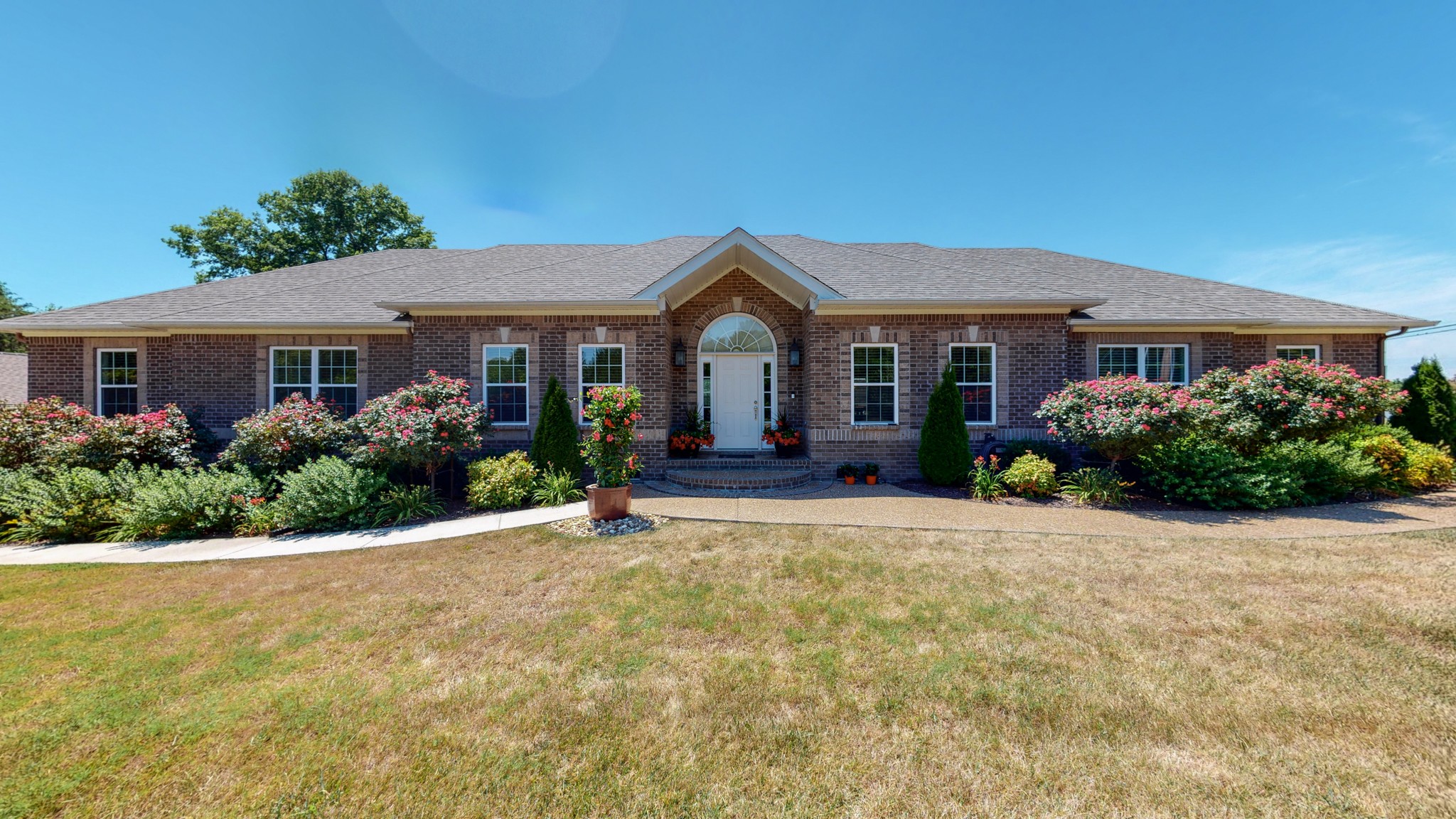 1439 Cliff Amos Road Spring Hill, TN 37174 - Photo 1 of 64 a front view of a house with a yard