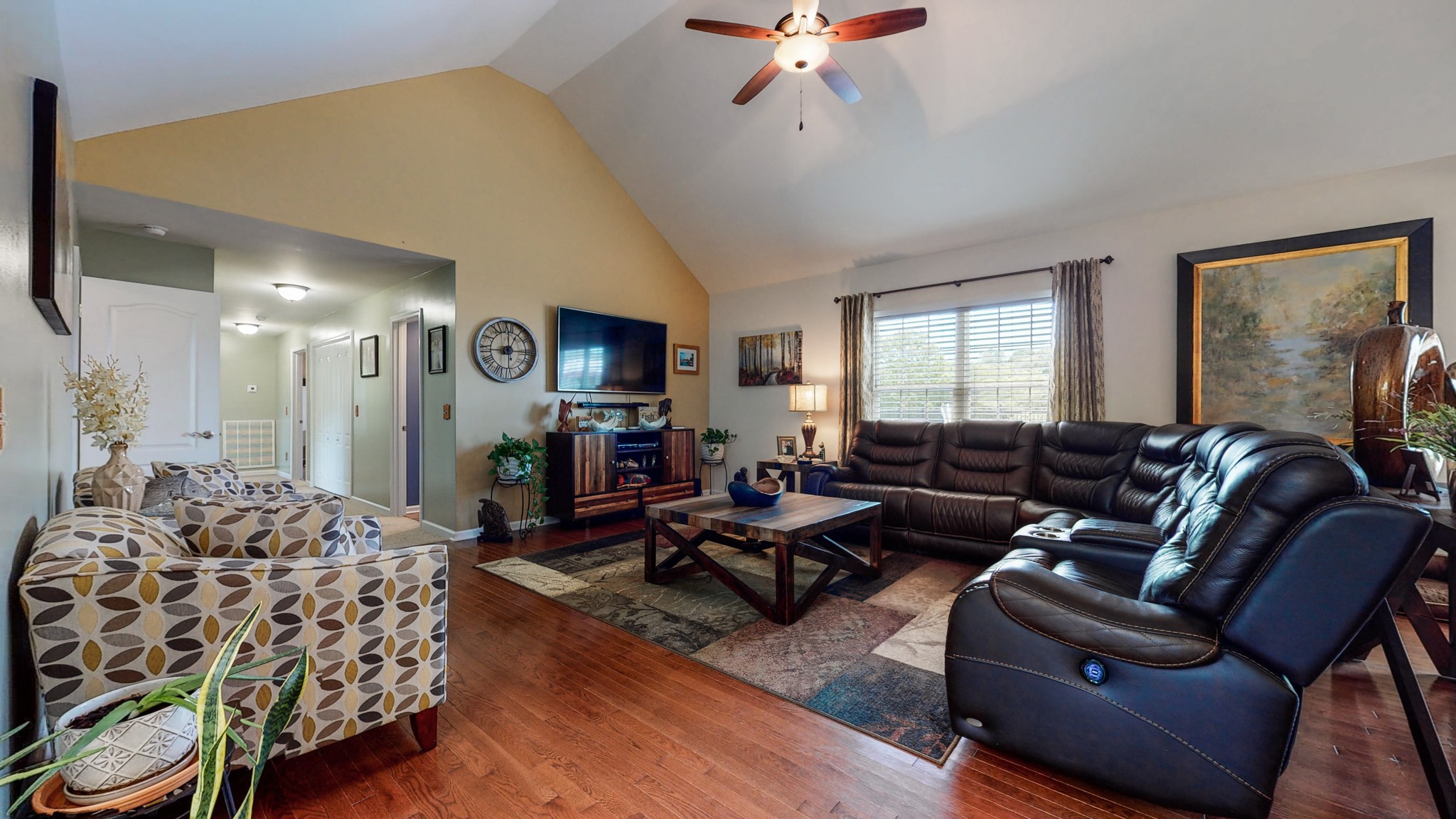 1439 Cliff Amos Road Spring Hill, TN 37174 - Photo 13 of 64 a living room with furniture and a flat screen tv
