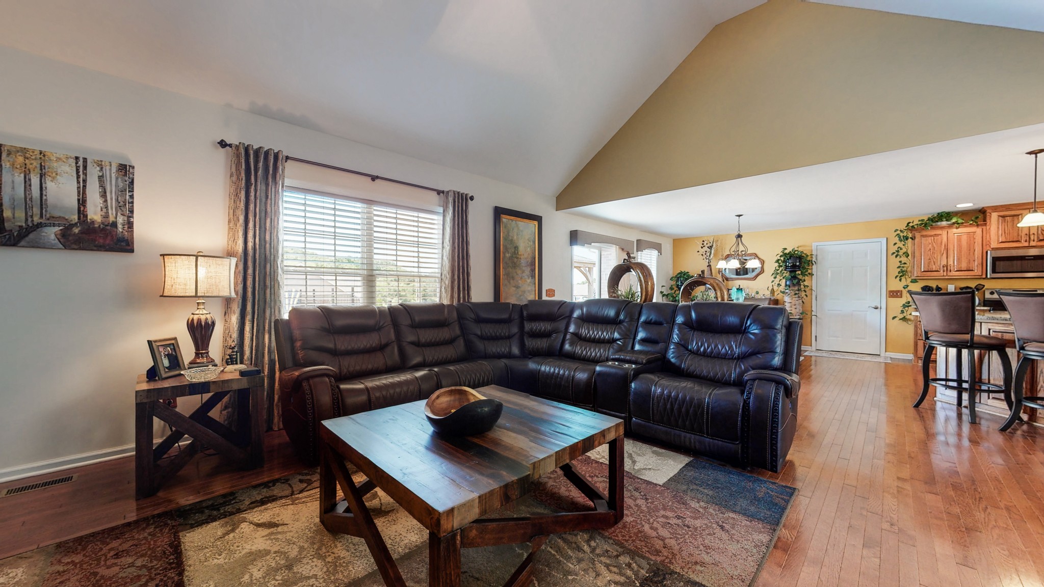 1439 Cliff Amos Road Spring Hill, TN 37174 - Photo 14 of 64 a living room with lots of furniture and a wooden floor
