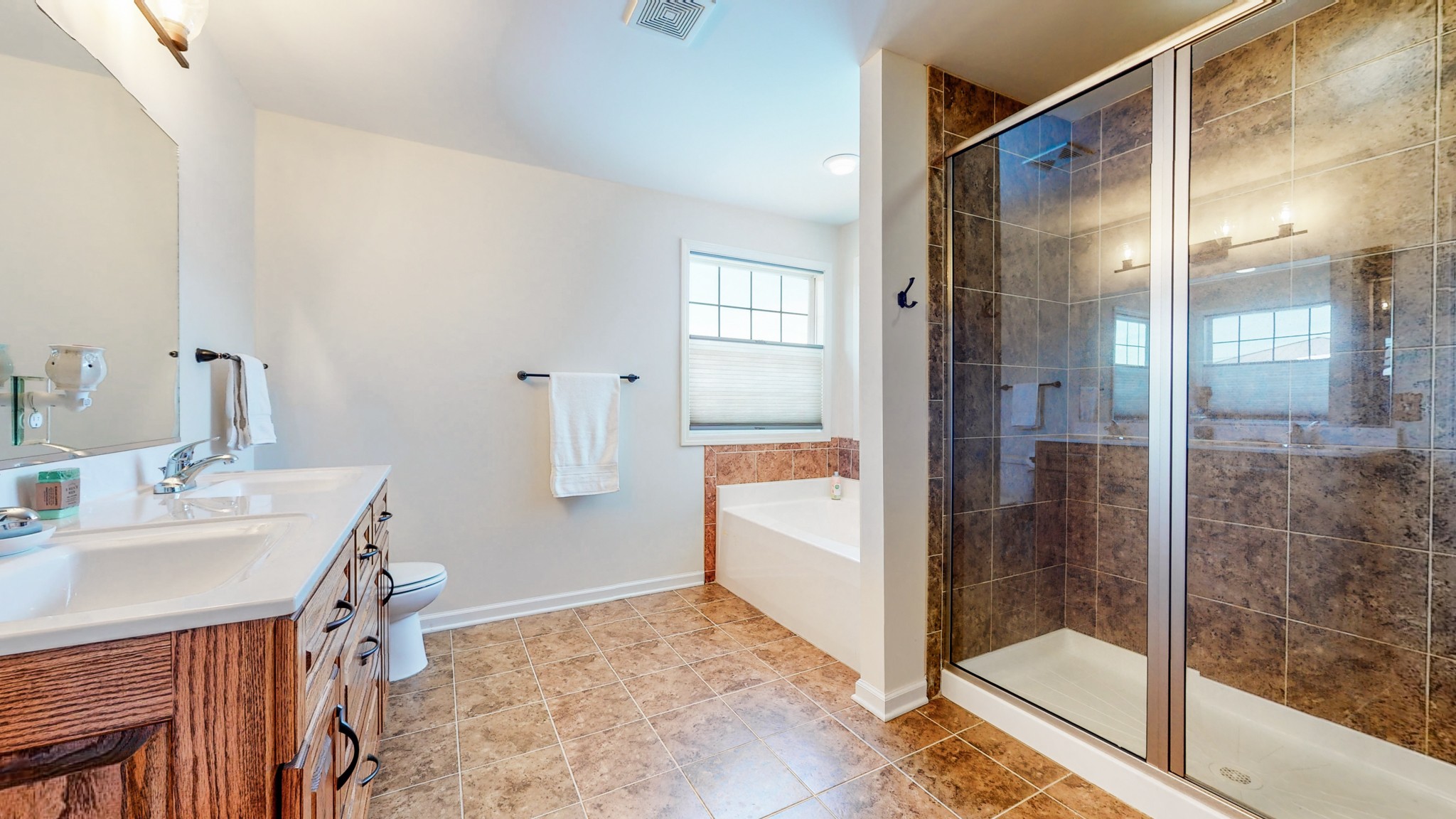 1439 Cliff Amos Road Spring Hill, TN 37174 - Photo 21 of 64 a bathroom with a tub and shower