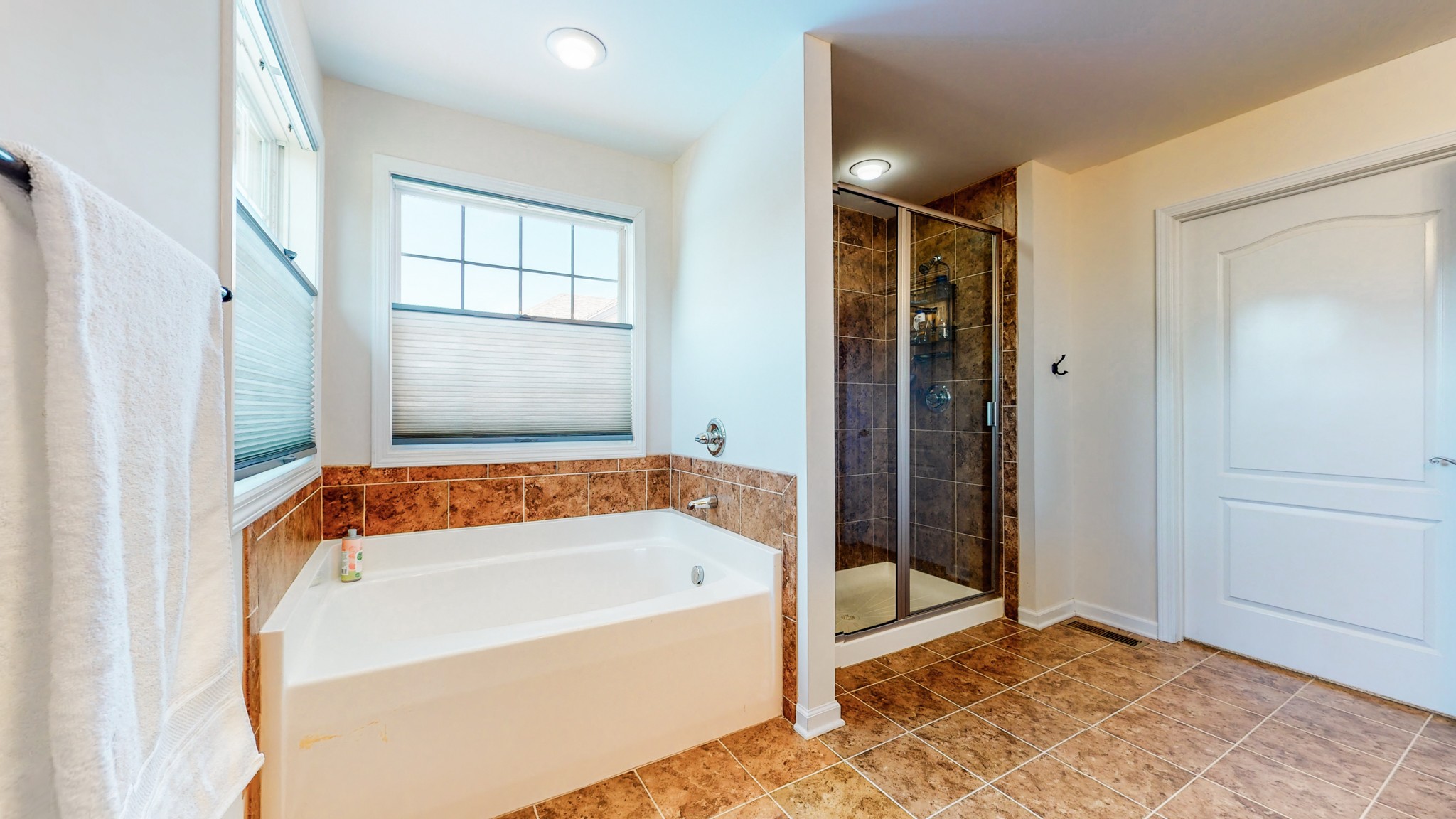 1439 Cliff Amos Road Spring Hill, TN 37174 - Photo 22 of 64 a bathroom with a bathtub and a shower