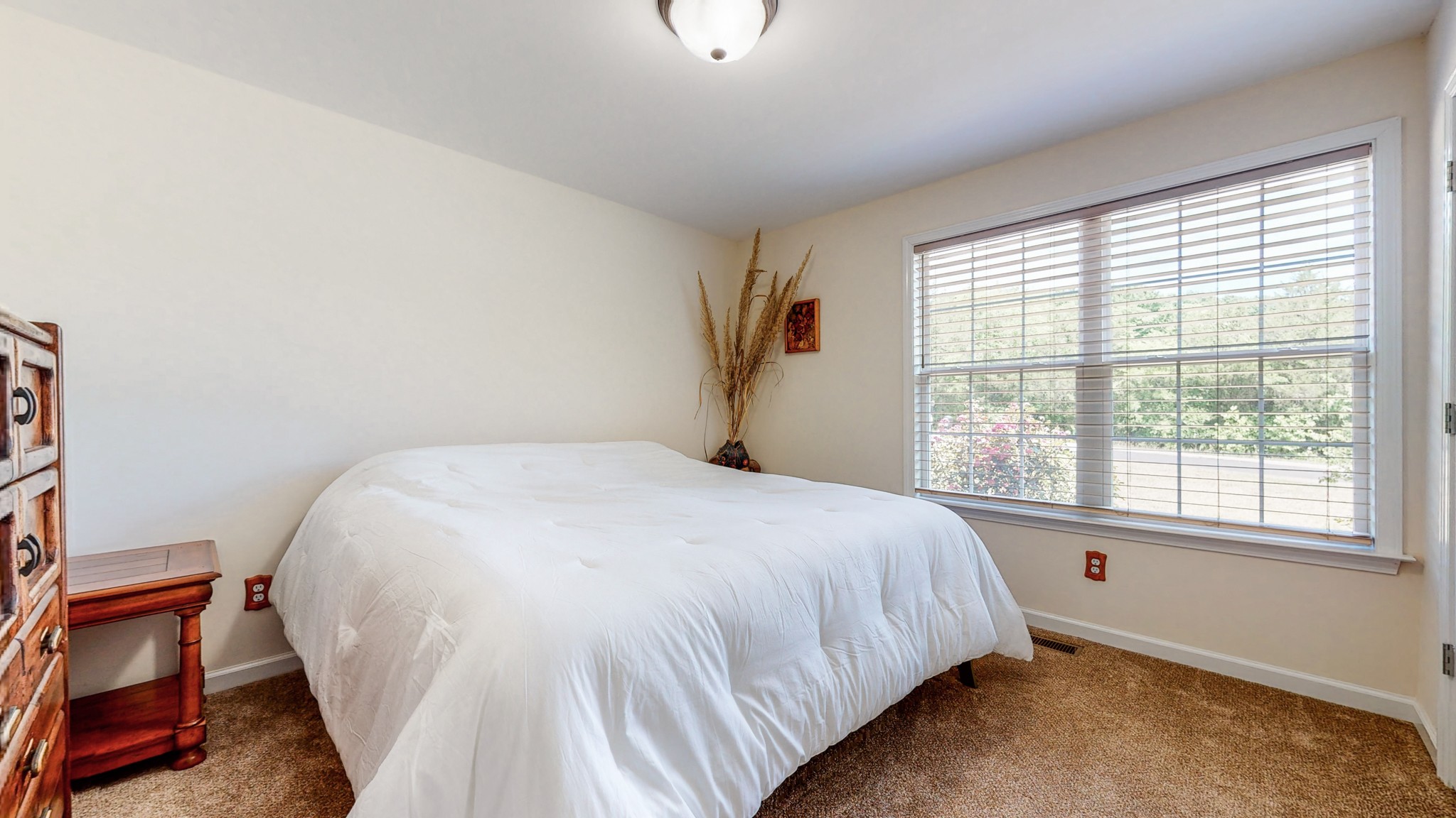 1439 Cliff Amos Road Spring Hill, TN 37174 - Photo 23 of 64 a bed sitting in a bedroom next to a window