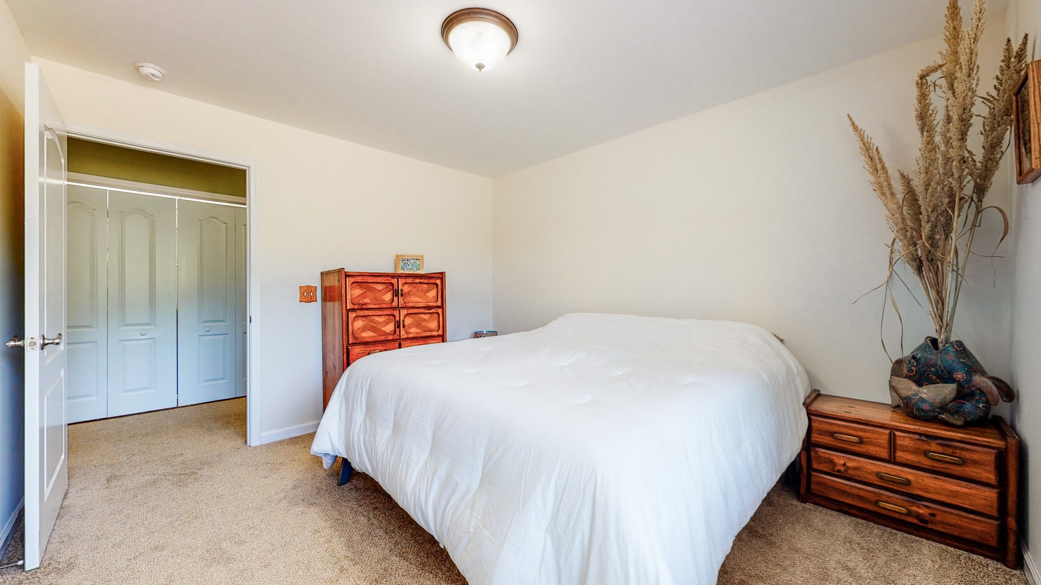 1439 Cliff Amos Road Spring Hill, TN 37174 - Photo 25 of 64 a bedroom with a bed and a potted plant
