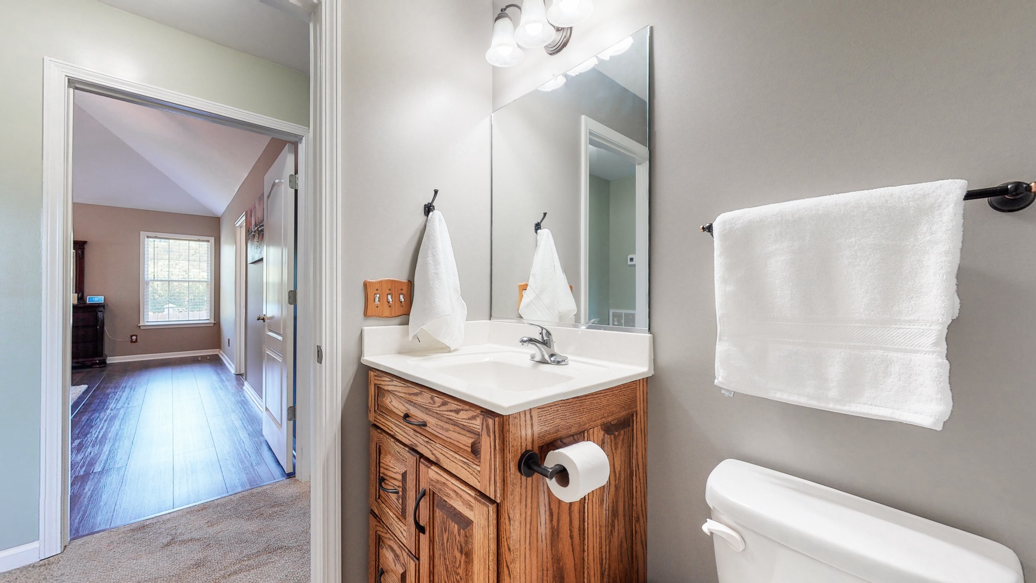 1439 Cliff Amos Road Spring Hill, TN 37174 - Photo 26 of 64 a bathroom with a sink a toilet and mirror