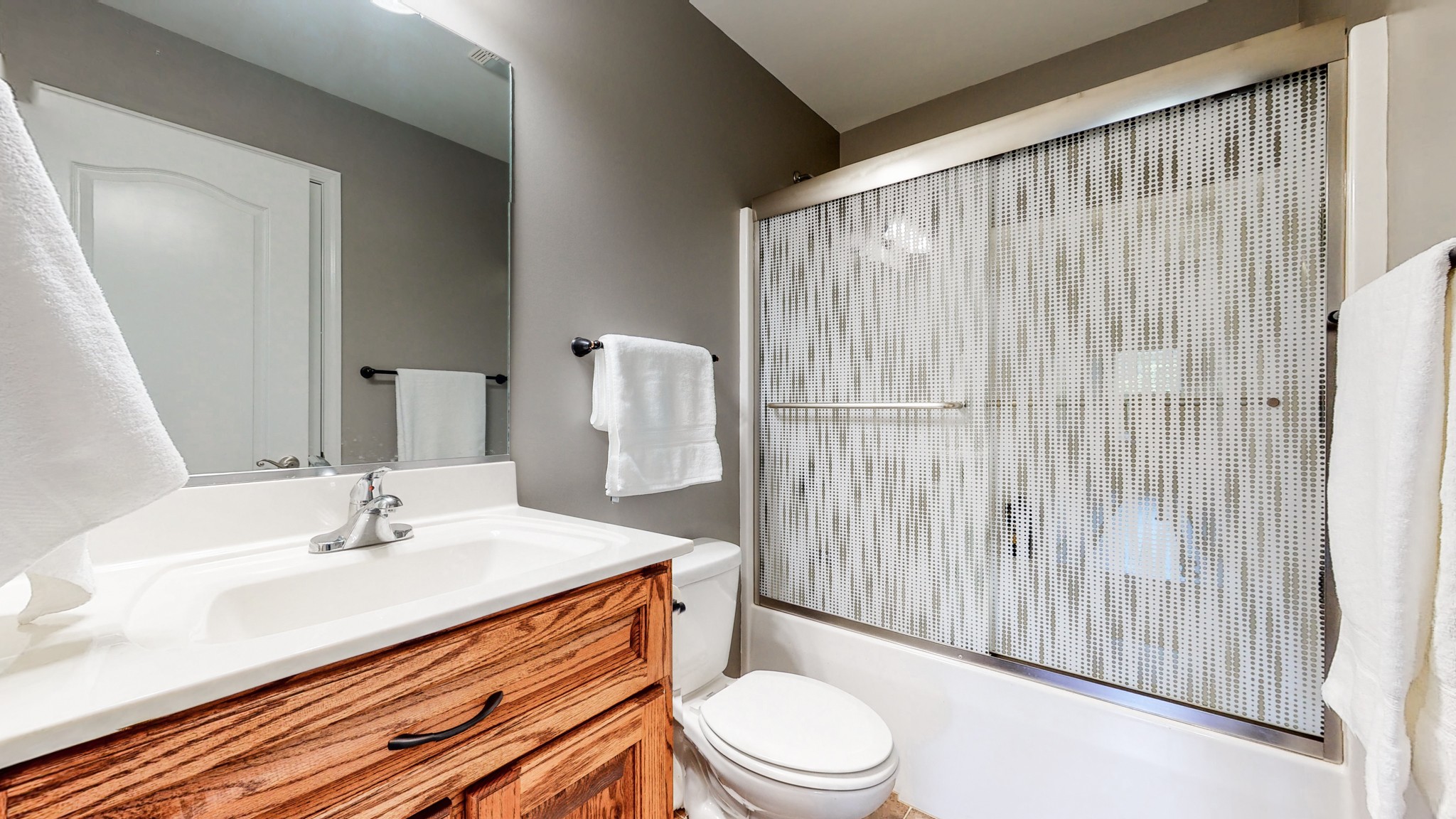 1439 Cliff Amos Road Spring Hill, TN 37174 - Photo 27 of 64 a bathroom with a sink a toilet and shower