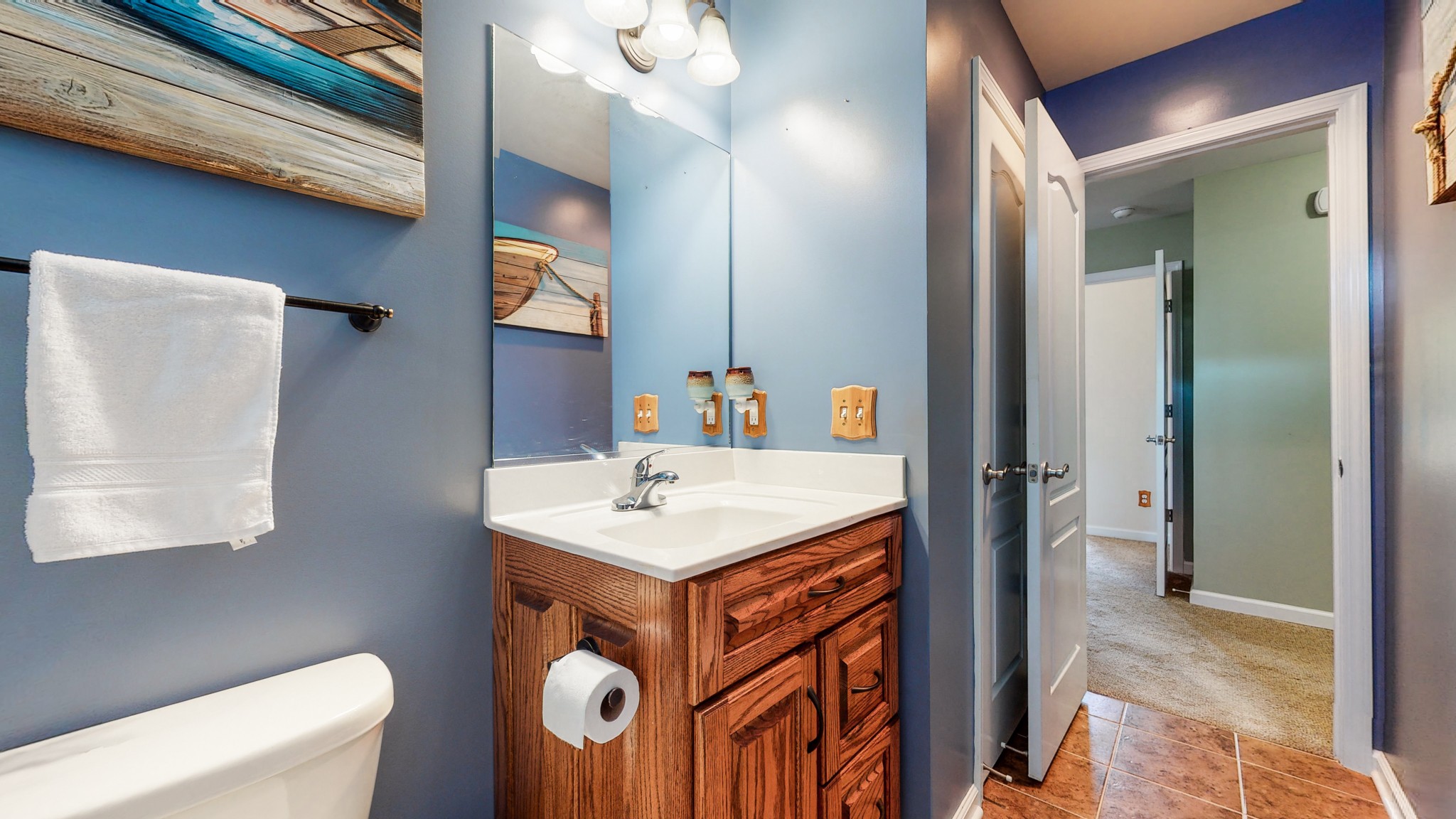 1439 Cliff Amos Road Spring Hill, TN 37174 - Photo 31 of 64 a bathroom with a sink a toilet and mirror
