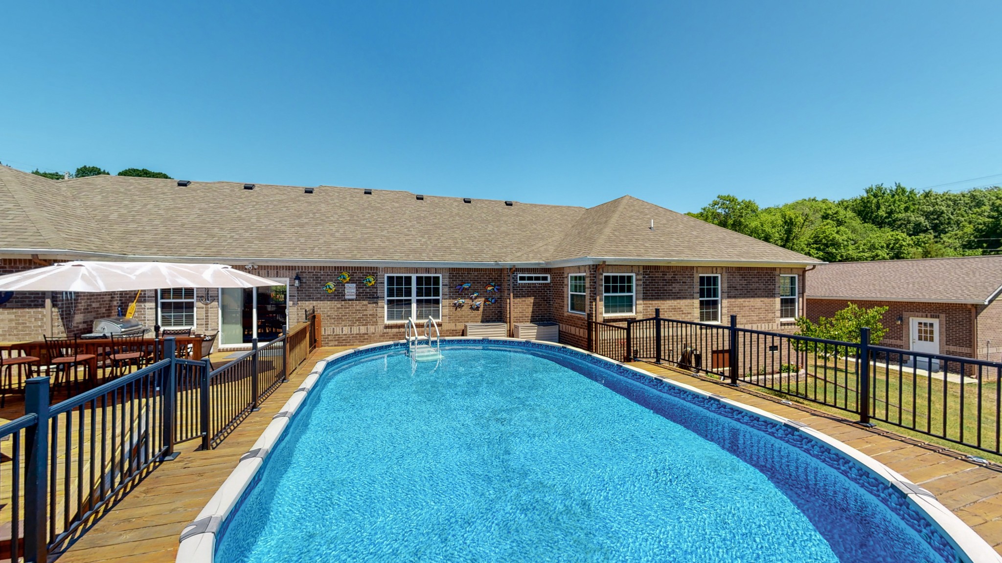 1439 Cliff Amos Road Spring Hill, TN 37174 - Photo 44 of 64 a view of a house with wooden deck and furniture