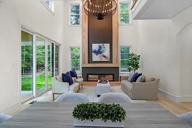 a bedroom with a large bed and a large window