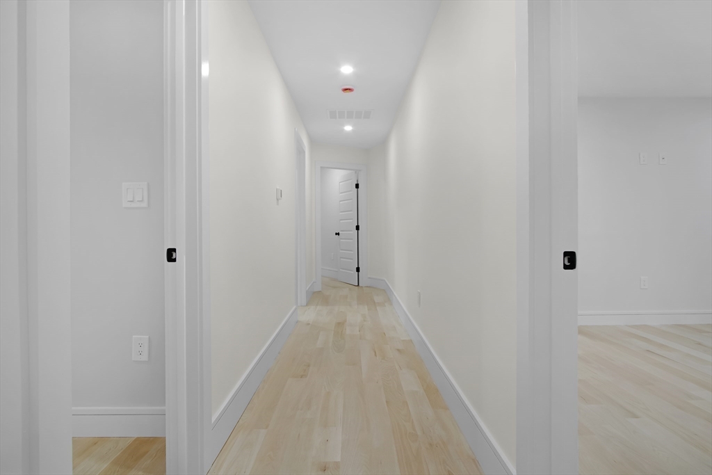 293 Cross Street Norwell, MA 02061 - Photo 18 of 38 a view of a hallway with wooden floor