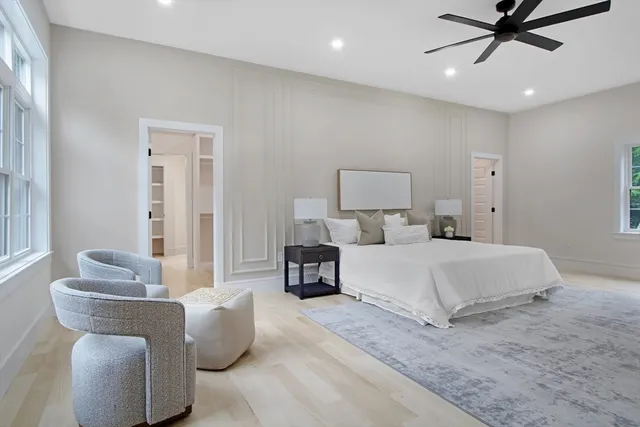 an empty room with windows and closet