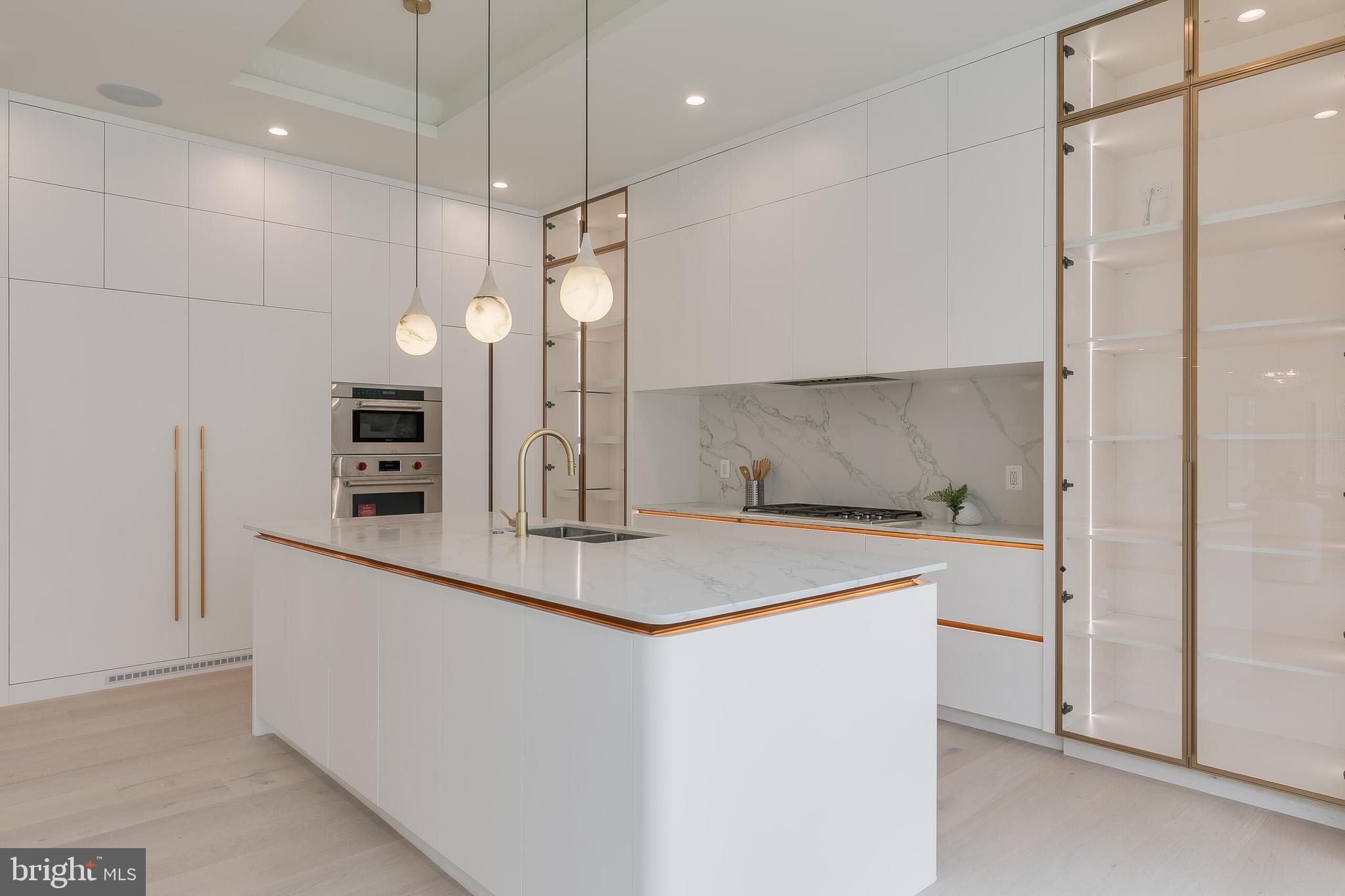 8757 Brook Road McLean, VA 22102 - Photo 17 of 45 a kitchen with a sink a counter space and stainless steel appliances