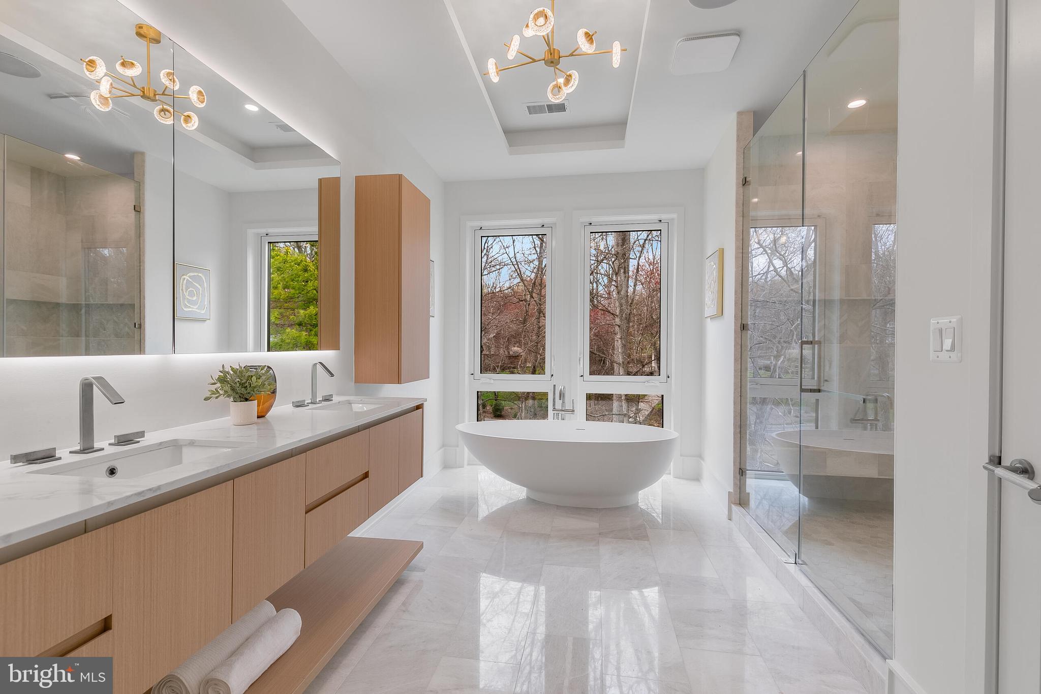 8757 Brook Road McLean, VA 22102 - Photo 28 of 45 a large bathroom with a large tub shower and sink