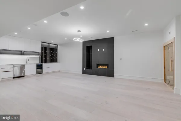 an empty room with wooden floor