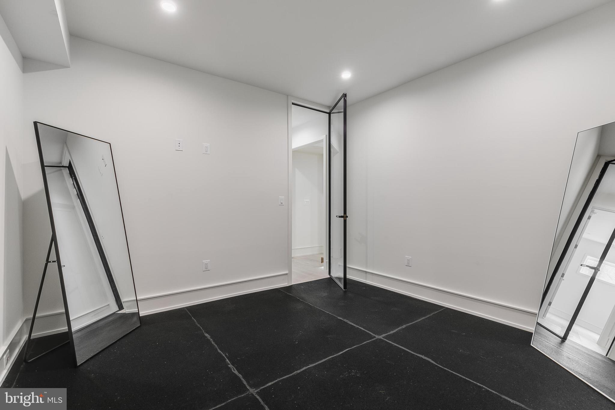8757 Brook Road McLean, VA 22102 - Photo 37 of 45 an empty room with wooden floor