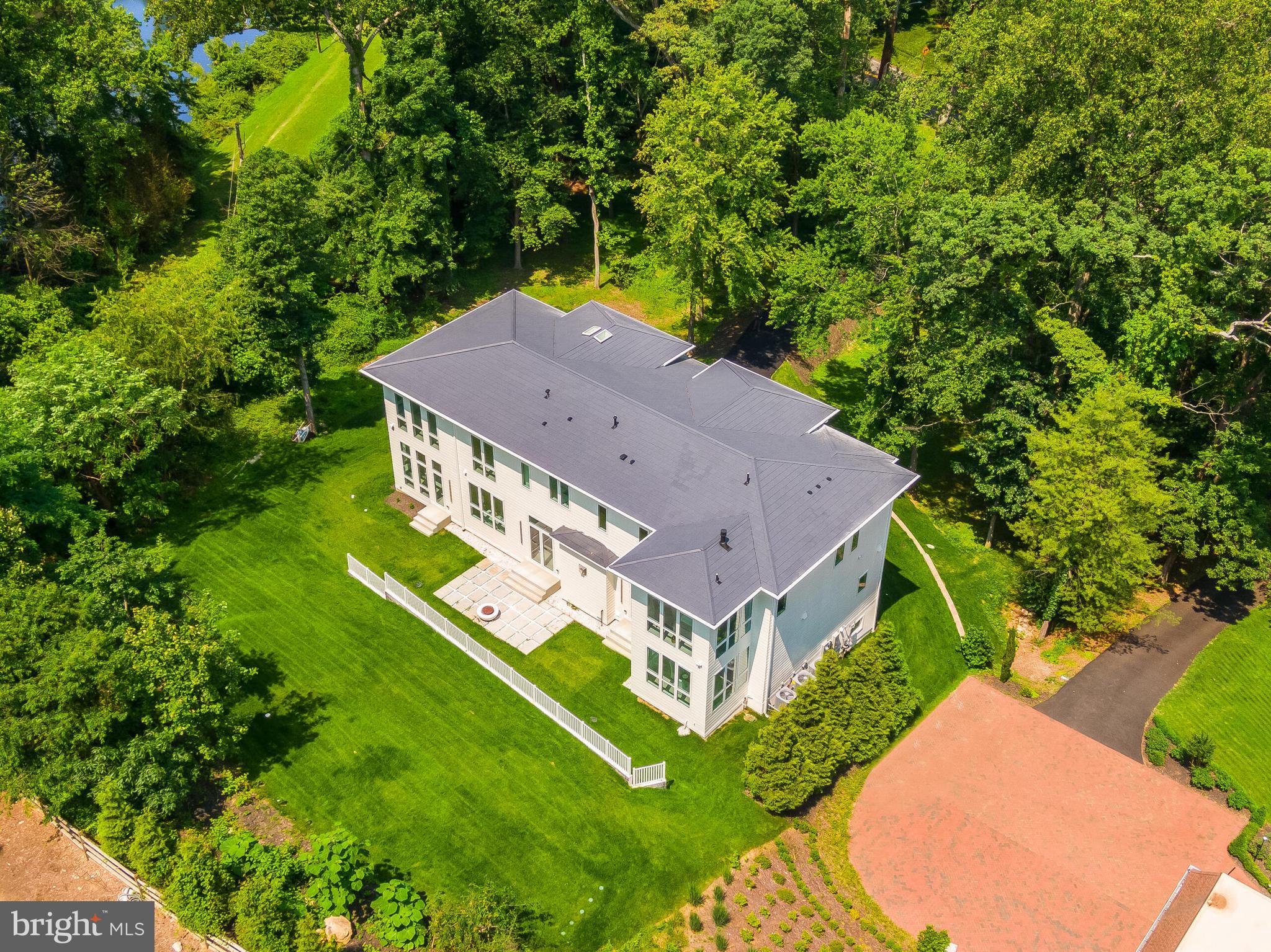 8757 Brook Road McLean, VA 22102 - Photo 45 of 45 a aerial view of a house with a big yard and large trees