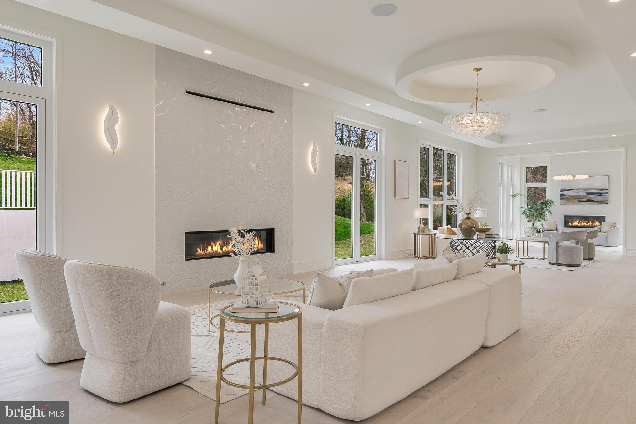 8757 Brook Road McLean, VA 22102 - Photo 10 of 45 a living room with furniture and a chandelier