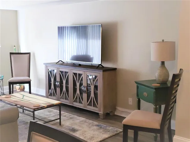 a view of a livingroom with furniture and wooden floor
