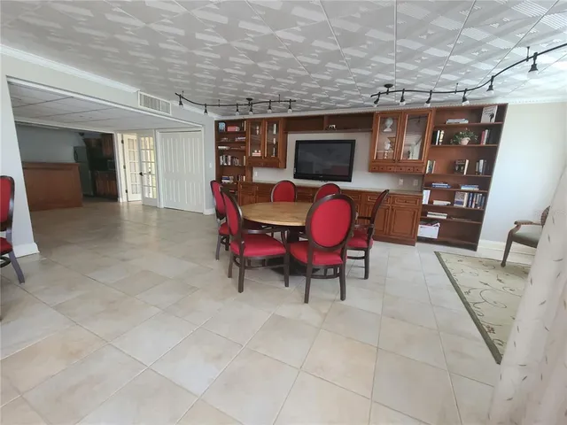a view of a chairs and table in the patio