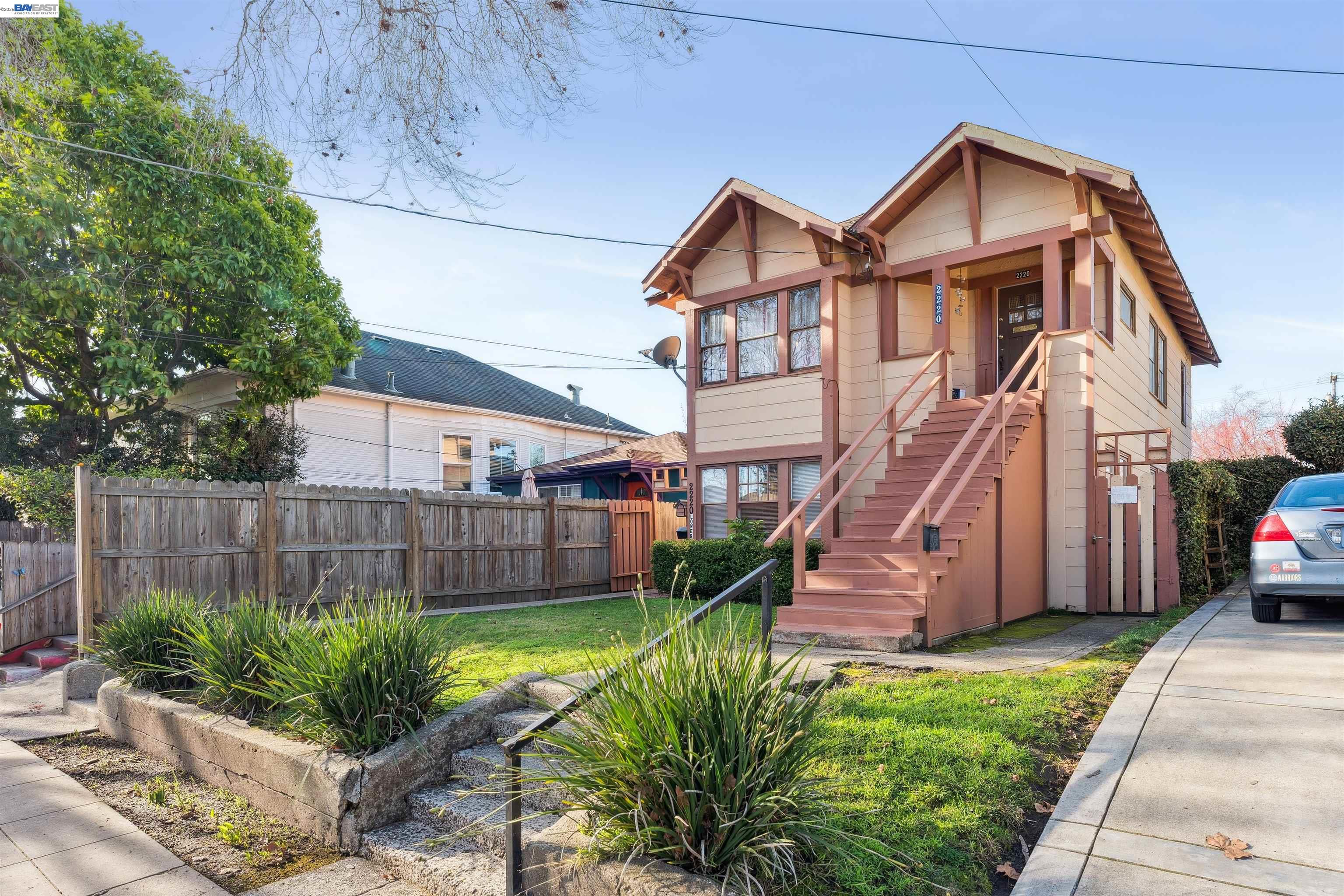2220 Seventh Street Berkeley, CA 94710 - Photo 3 of 5 a view of a big house with a big yard plants and large tree