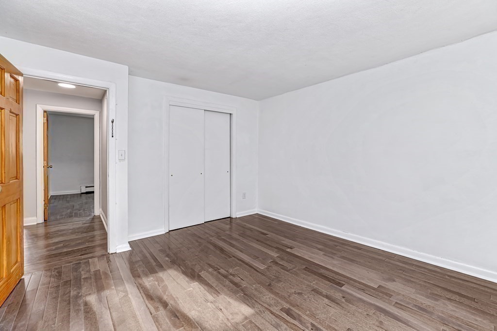 10 Bryon Road, Unit 4 Boston, MA 02467 - Photo 15 of 27 a view of a room with wooden floor