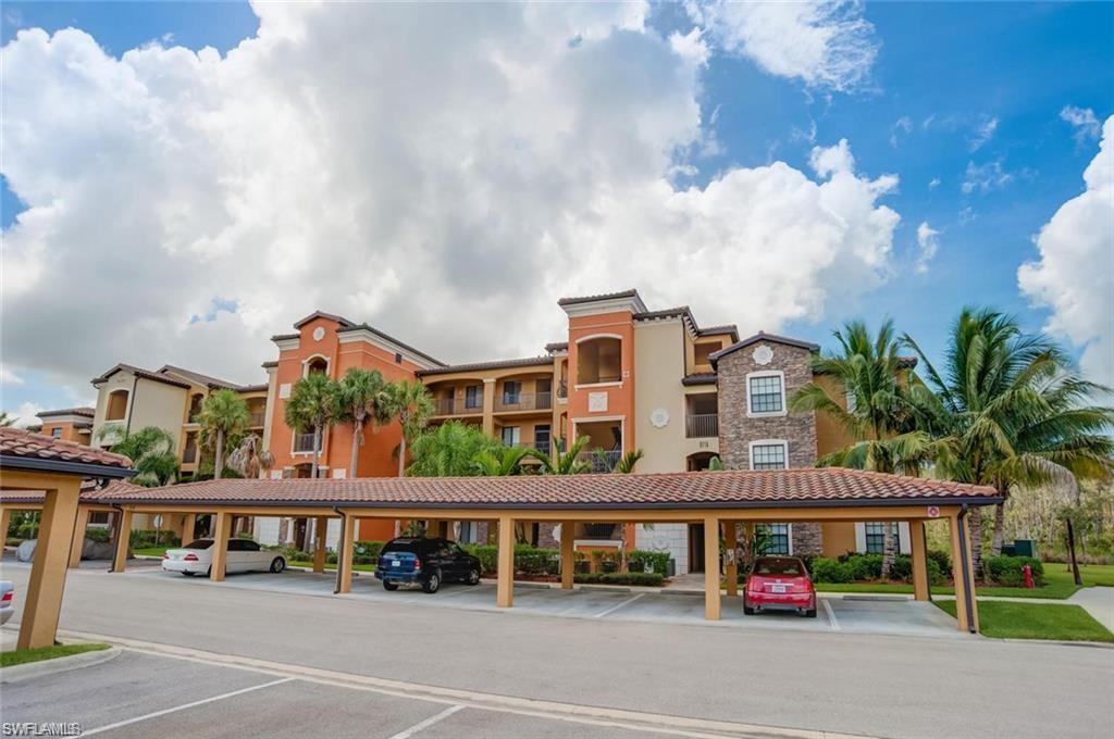 9715 Acqua Court, Unit 127 Naples, FL 34113 - Photo 5 of 50 a view of a building with cars parked