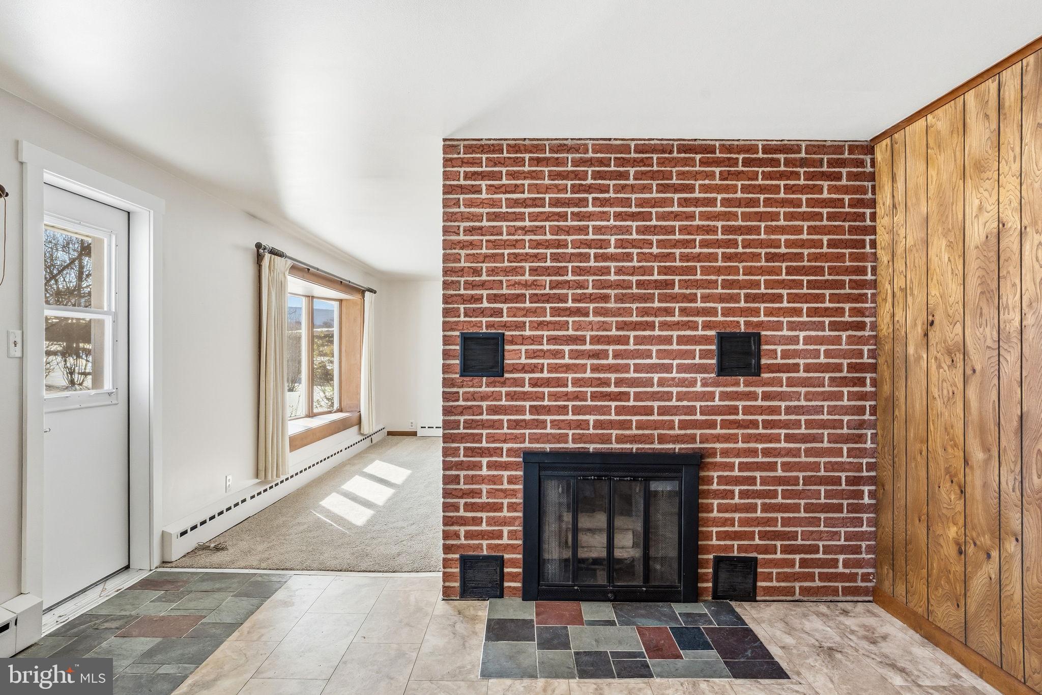 610 East Market Street Beavertown, PA 17813 - Photo 12 of 46 a view of a brick wall with windows