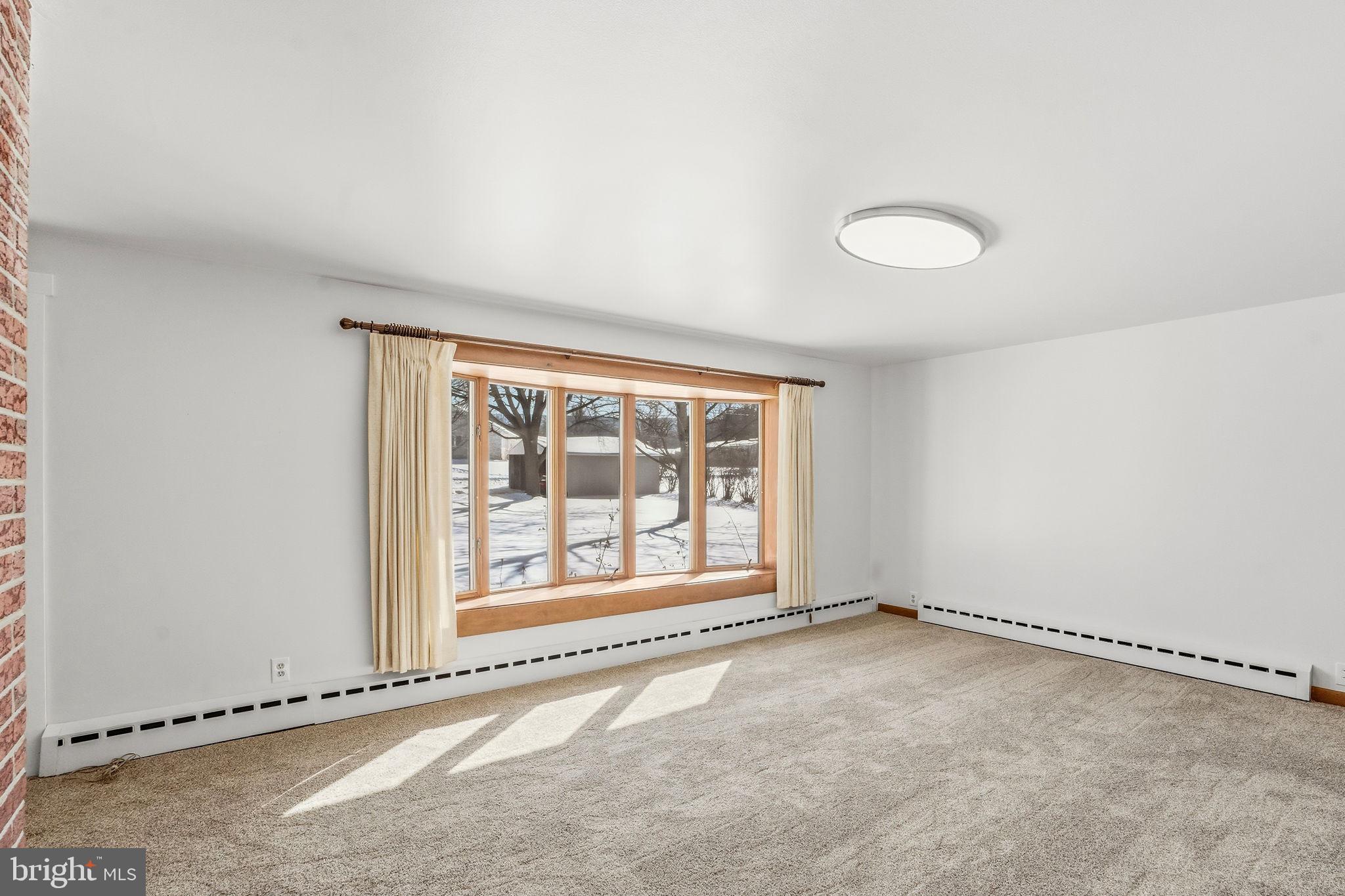 610 East Market Street Beavertown, PA 17813 - Photo 14 of 46 a view of an empty room with a window
