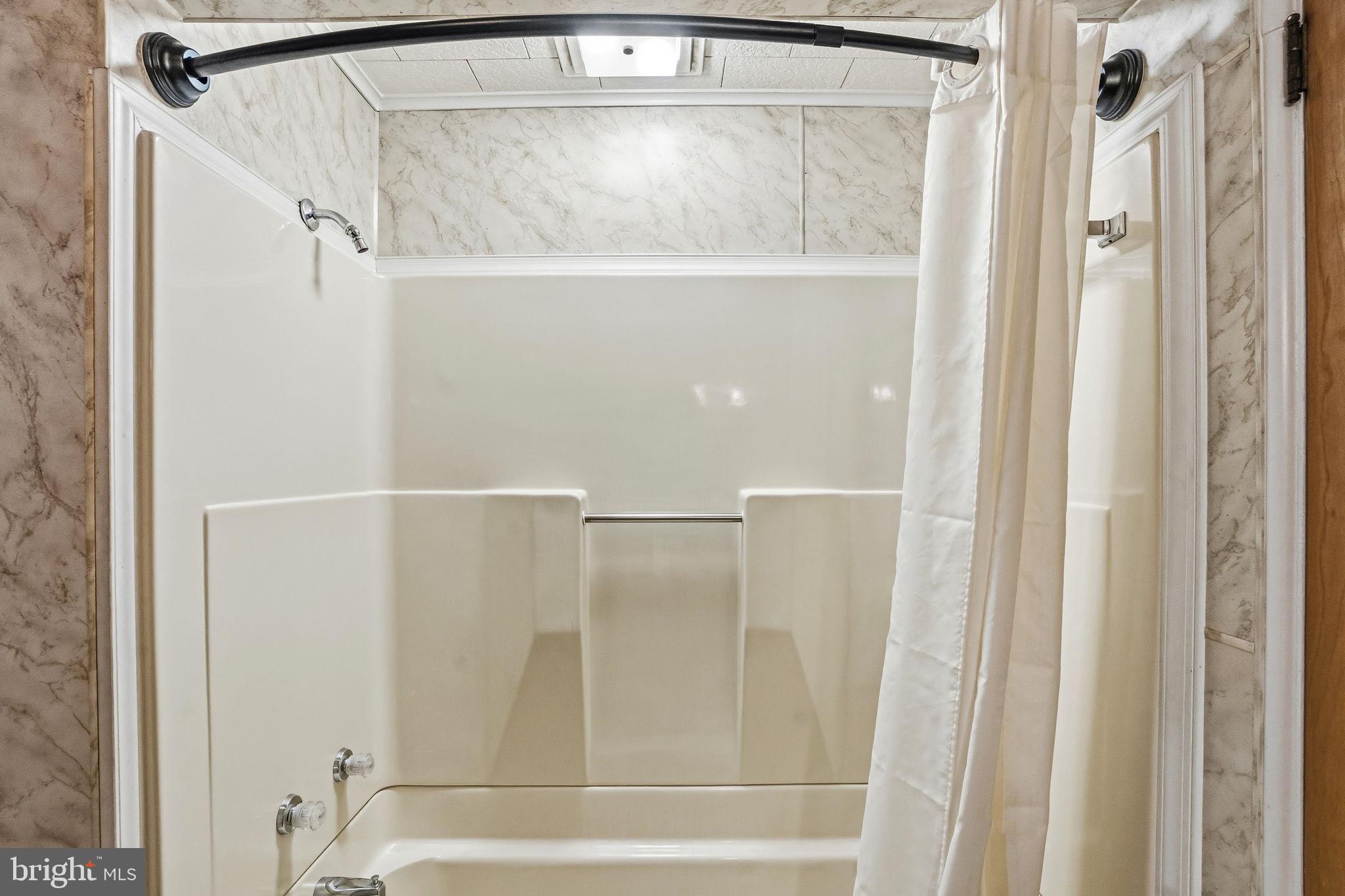 610 East Market Street Beavertown, PA 17813 - Photo 18 of 46 a bathroom with a glass shower door