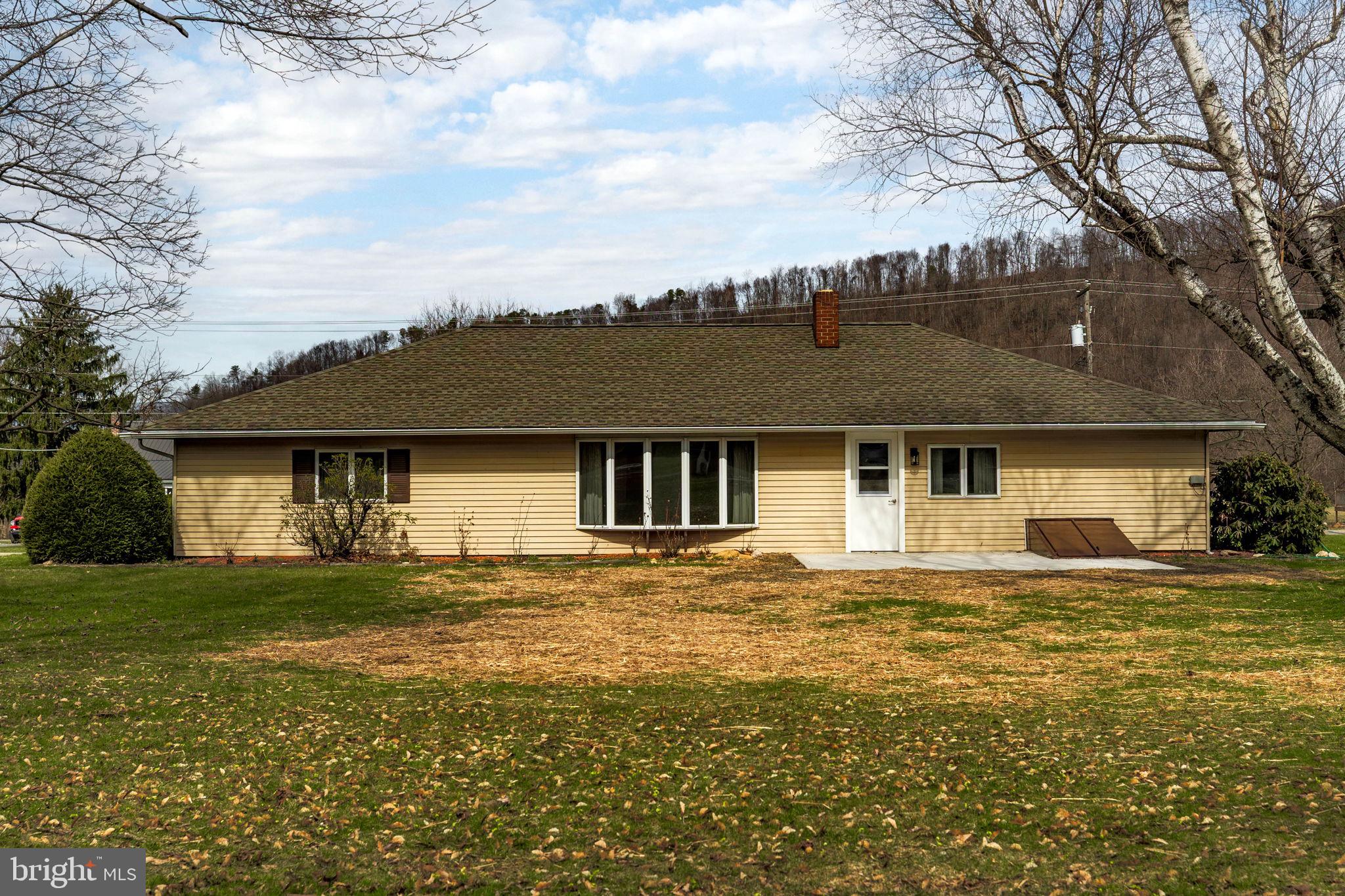 610 East Market Street Beavertown, PA 17813 - Photo 2 of 46 front view of a house with a yard